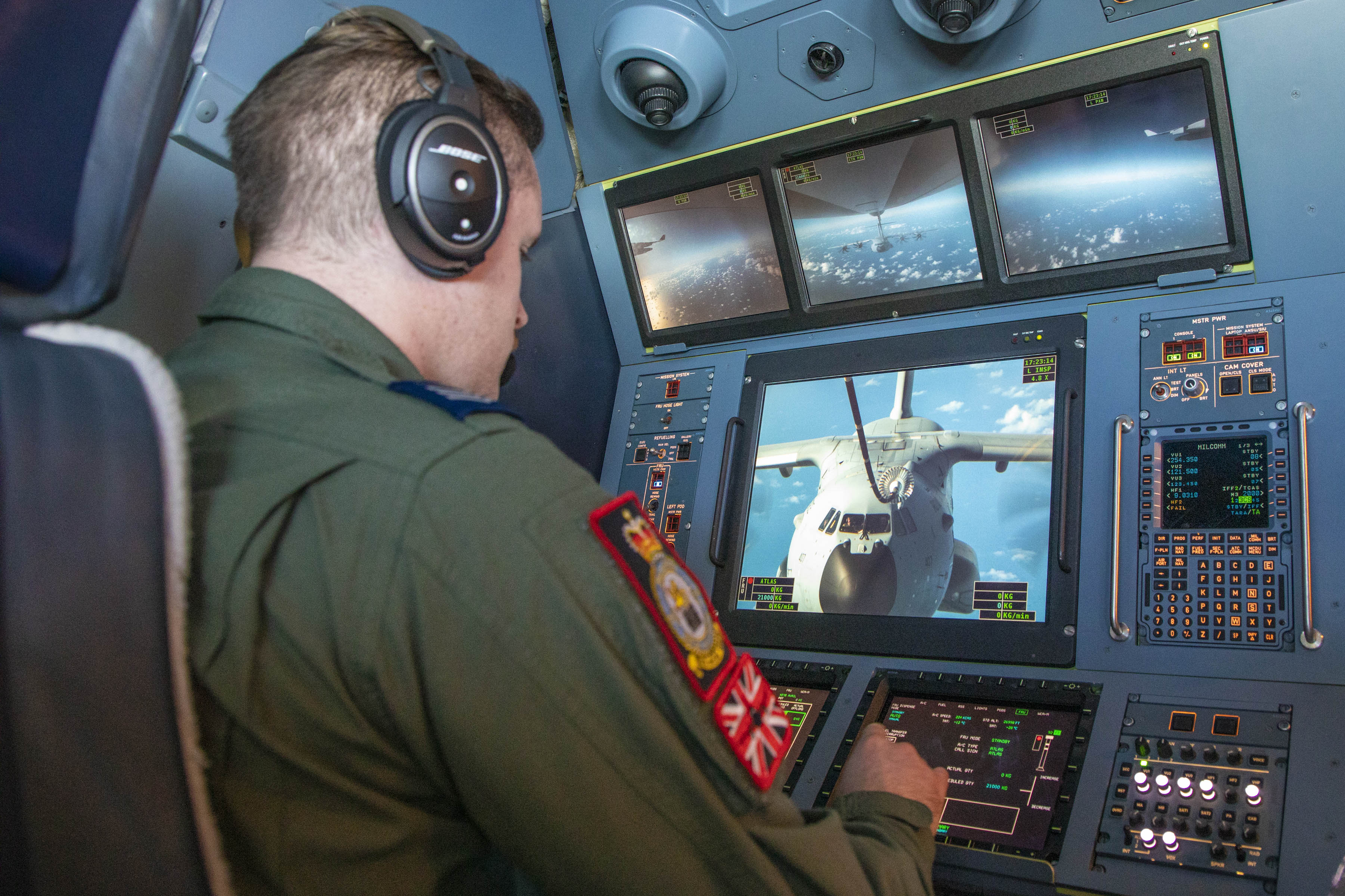 Image shows RAF pilot in transport aircraft cockpit.